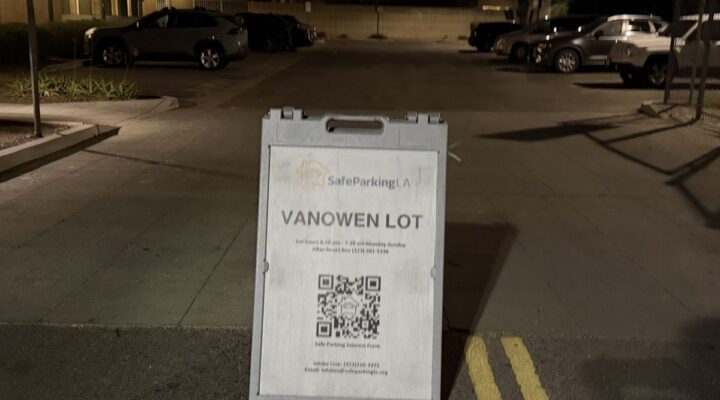 A sign in a parking lot reads 